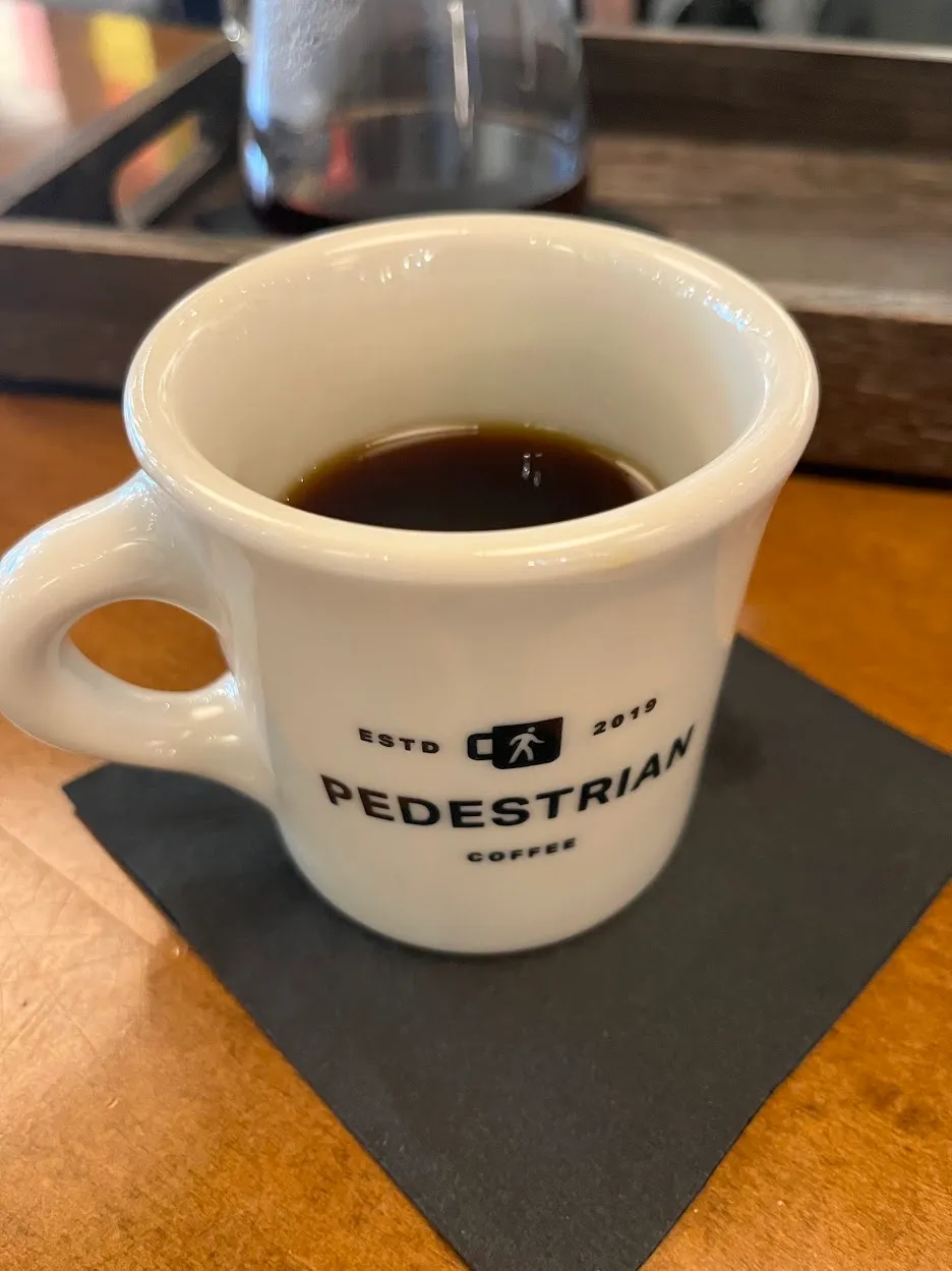 White diner-style coffee mug that says "Estd 2019 PEDESTRIAN COFFEE"