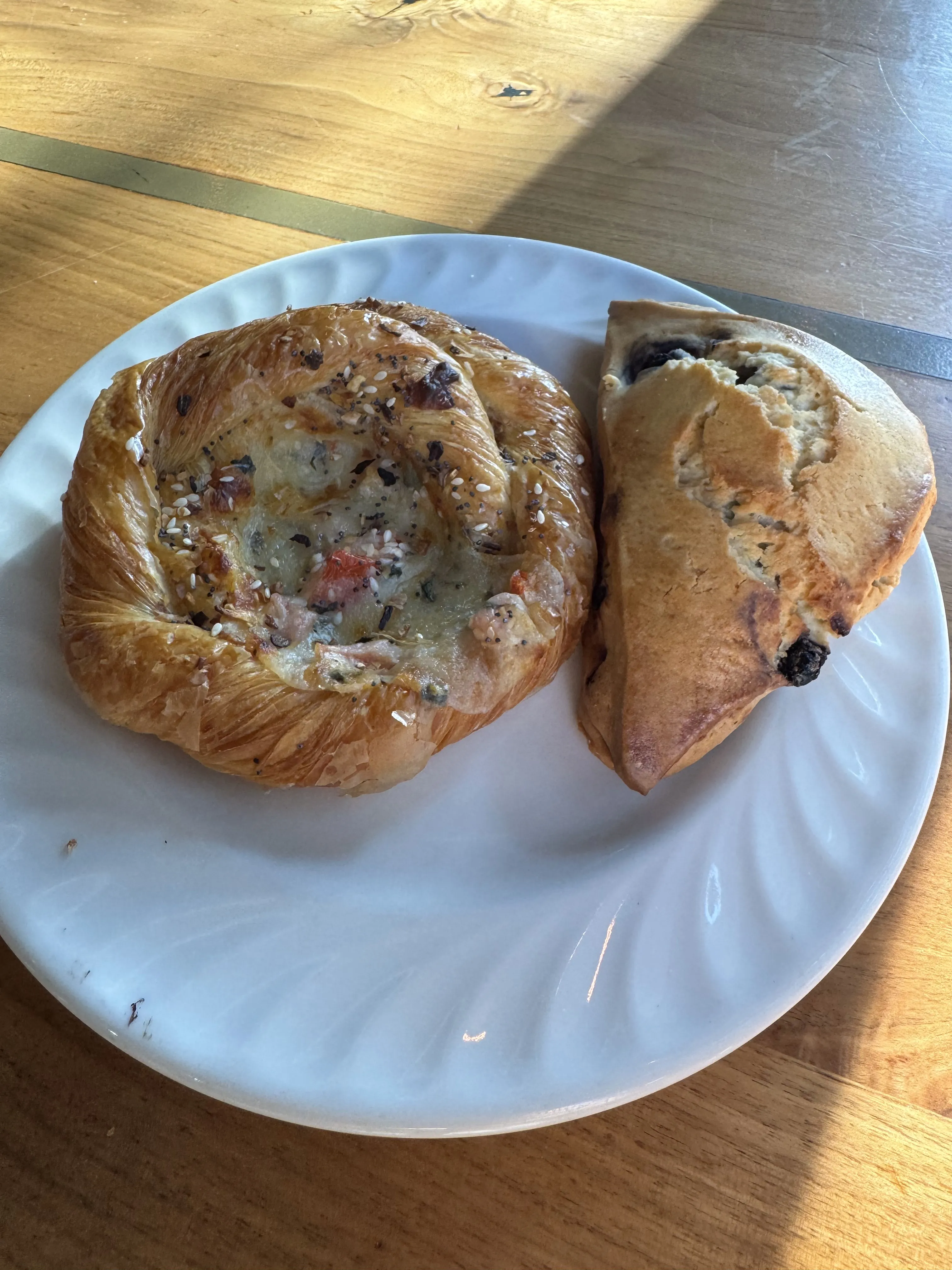 Tomato-Basil danish and blueberry scone on a plate