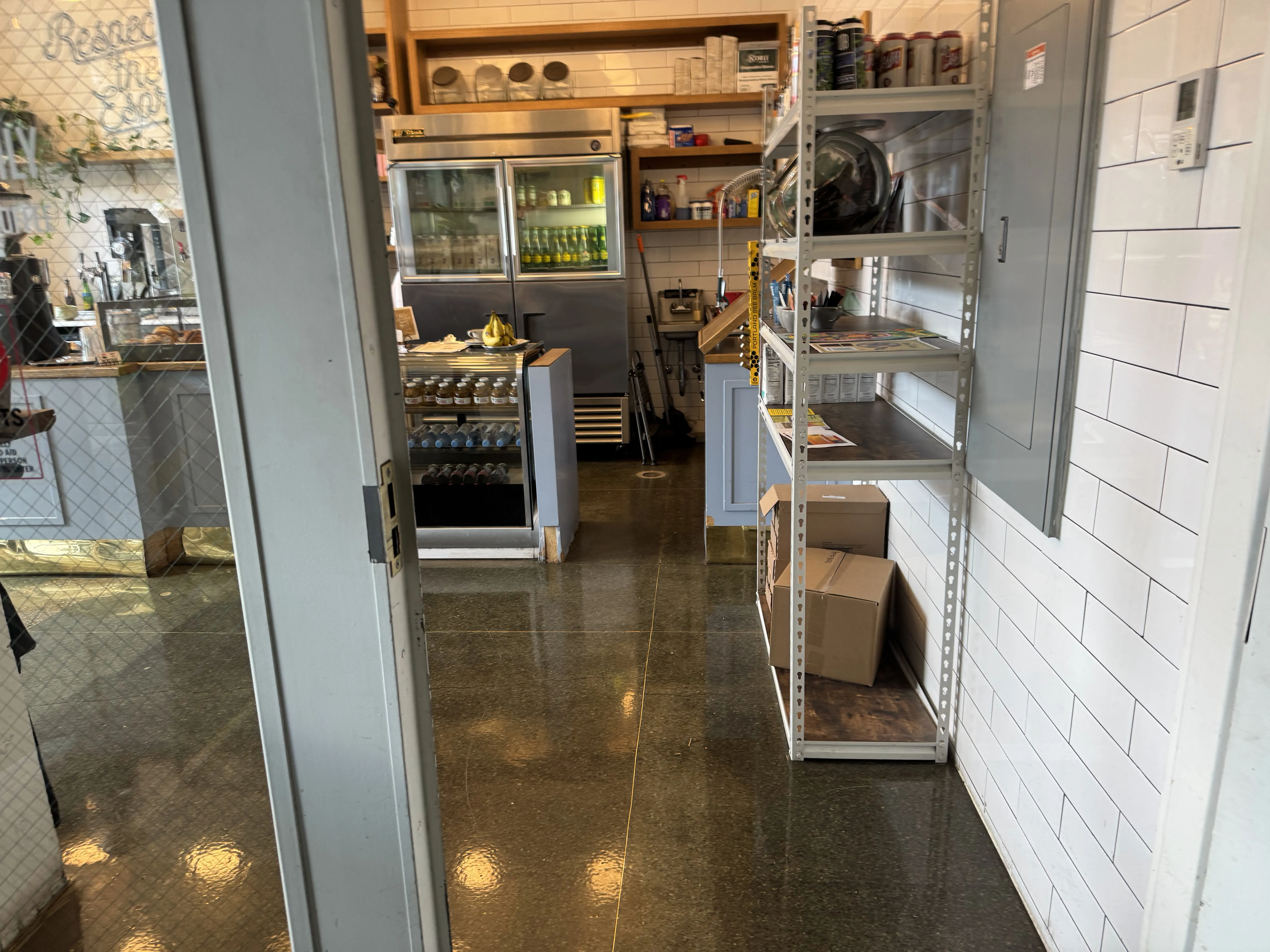 Cheeky photo of the "outpost". It's a small room off to the side from a larger lobby area, with space just for some shelves, the barista bar, and some simple bar seating