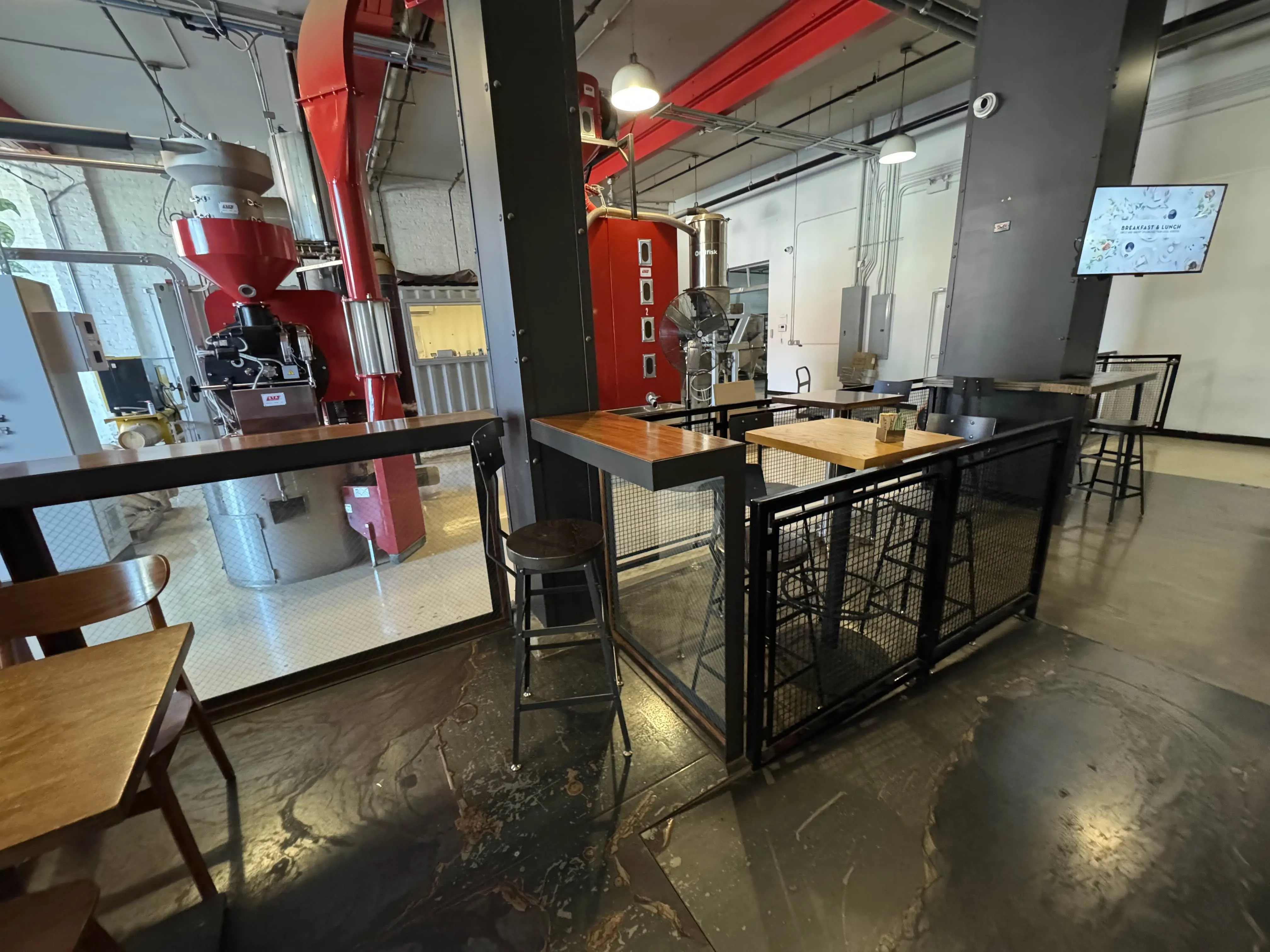 Zoomed out view of the roasting area, immediately beside many high-chair/stool seating options