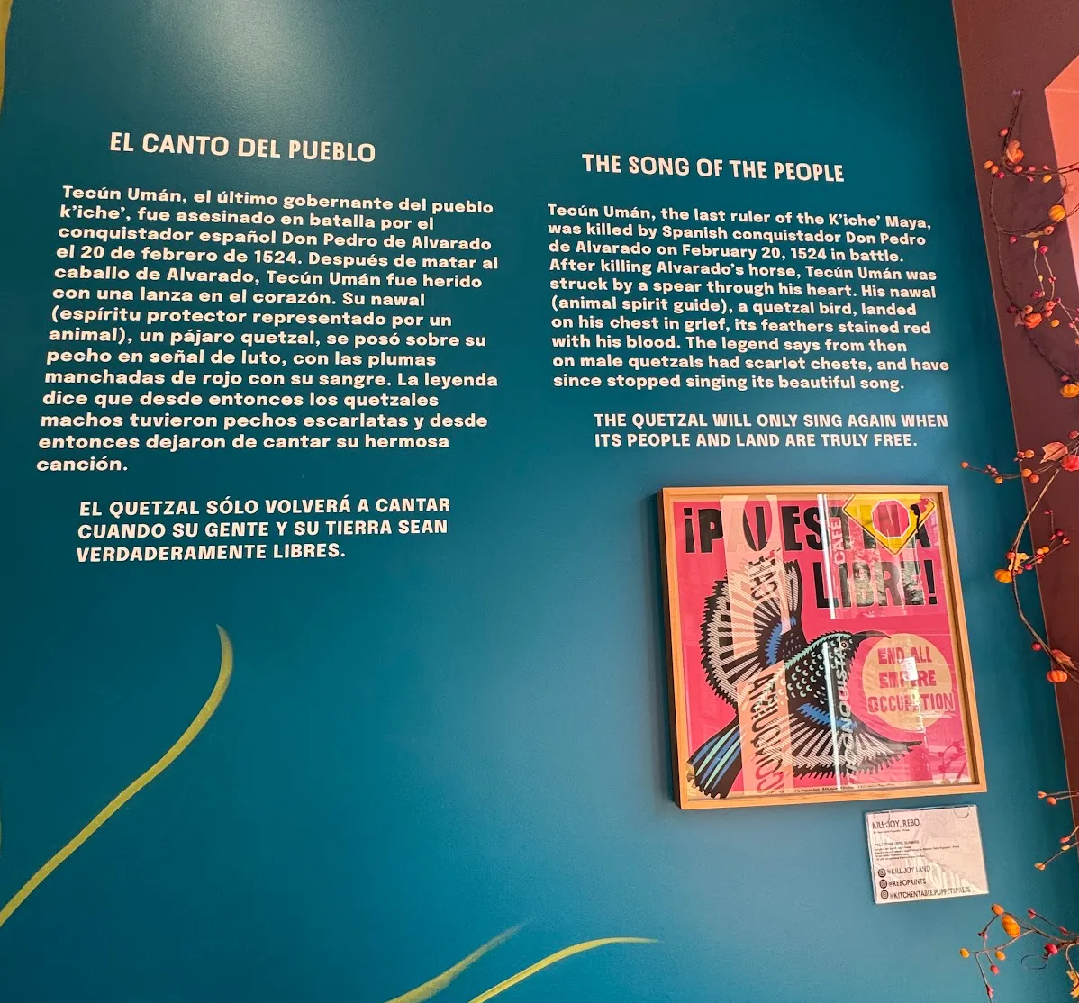 Close-up photo of the "Song of the people" written in Spanish on the left, English on the right. It is a story about the death Tecún Umán of the Maya by colonial violence, and how "The Quetzal will only sing again when its people and land are truly free"