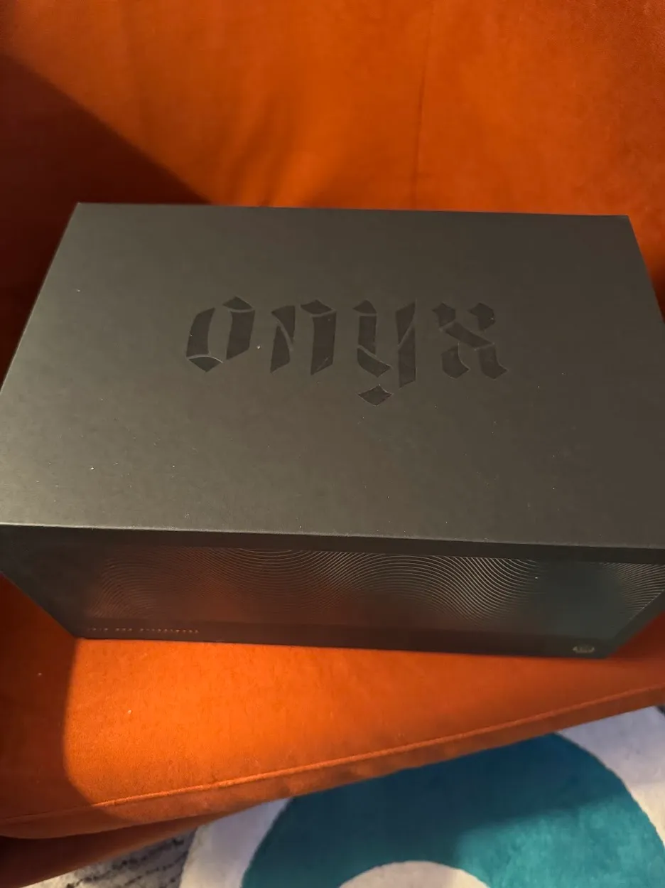 Black onyx box on a red-orange chair